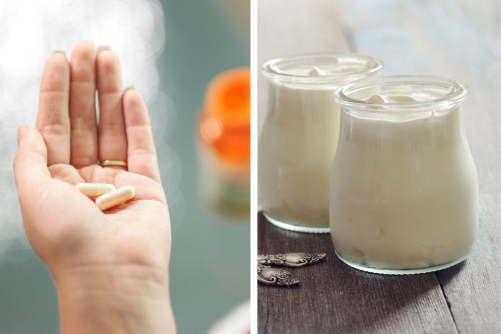Probiotics in hand and yogurt on table